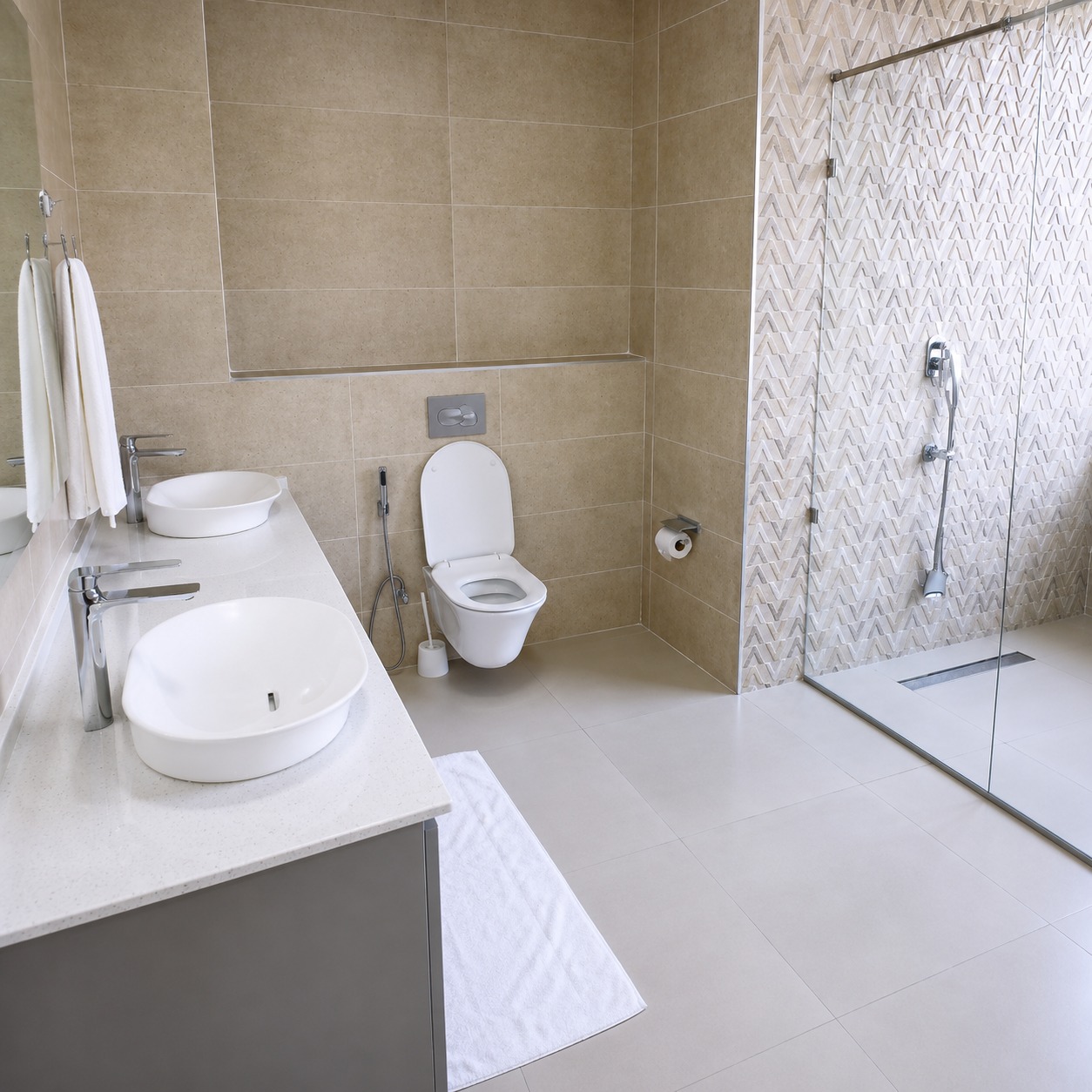 Modern master bathroom with clean tiles, shower area, and elegant fittings